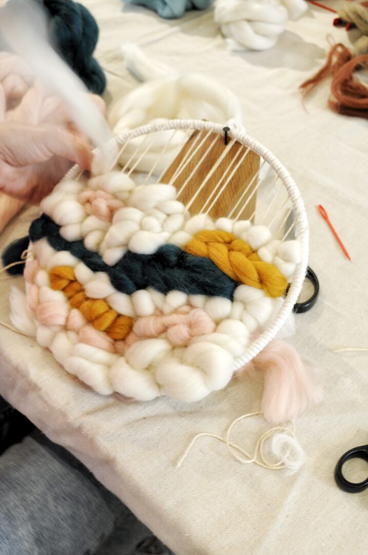 Gallery 1 - A participants circular loom with chunky Merino wool roving